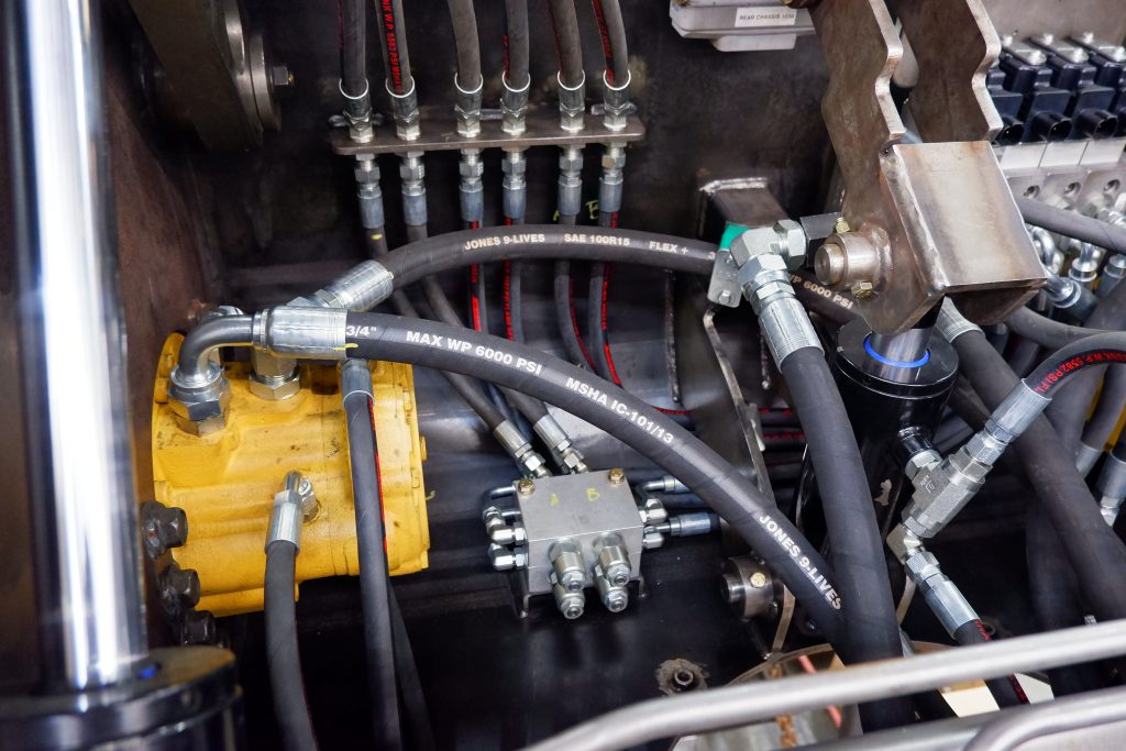 Hydraulic hoses, fittings, and pump installed into a new Flexgvator